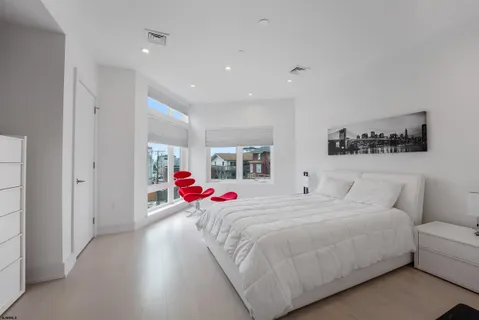 a bedroom with a bed and a couch