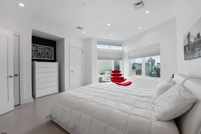 a bedroom with a bed and a walk in closet