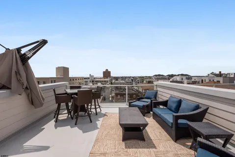 a view of a terrace with seating area