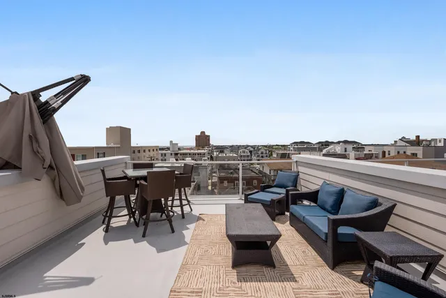 a view of a terrace with seating area