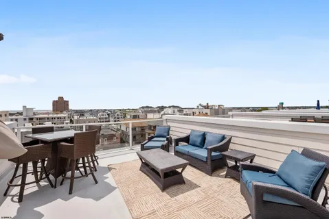 a view of roof deck with seating space