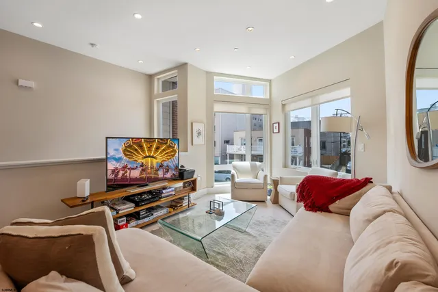 a bedroom with furniture and a flat screen tv