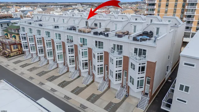 a car parked in front of a white building