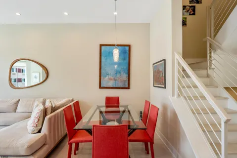 a group of chairs sitting next to a living room