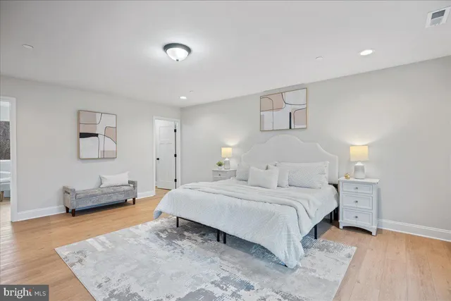 a bedroom with a bed and a couch