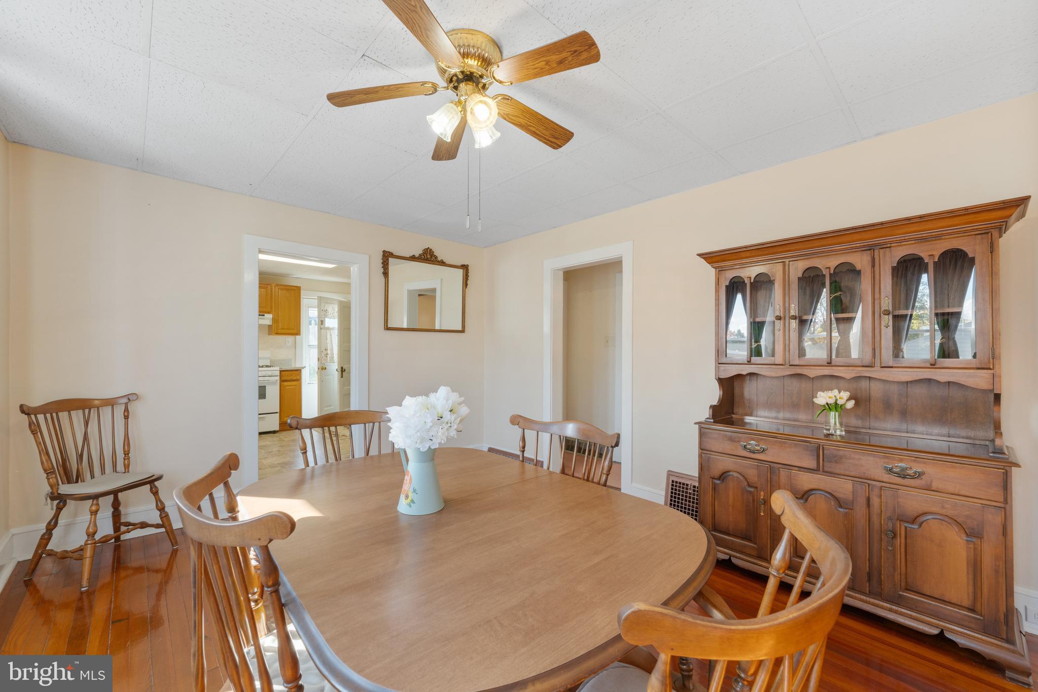 226 South Pine Avenue Maple Shade, NJ 08052 - Photo 12 of 39 a view of a dining room with furniture a chandelier and wooden floor