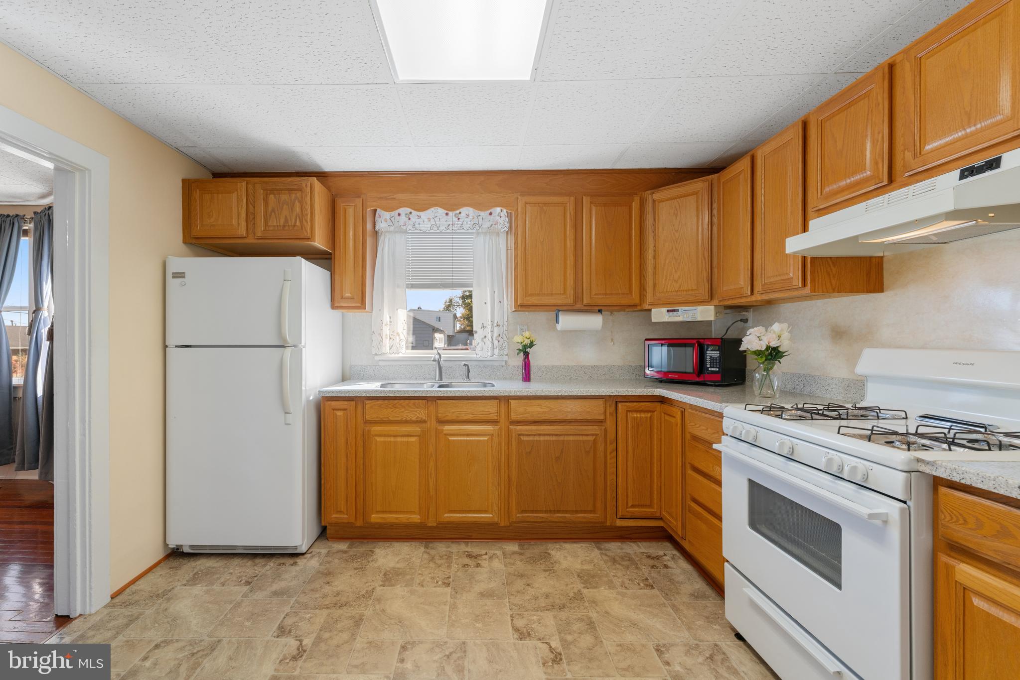 226 South Pine Avenue Maple Shade, NJ 08052 - Photo 15 of 39 a kitchen with stainless steel appliances granite countertop a refrigerator sink stove and white cabinets