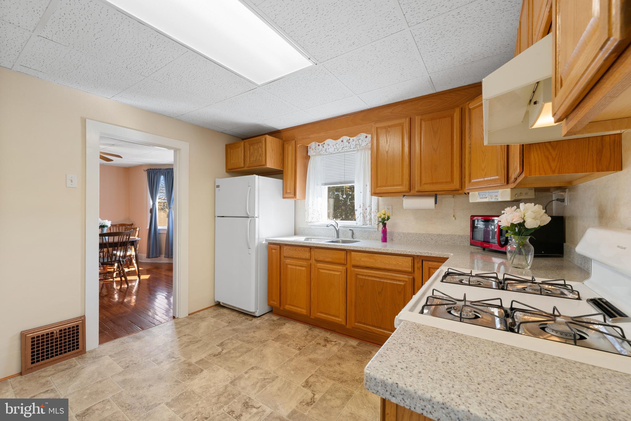 226 South Pine Avenue Maple Shade, NJ 08052 - Photo 16 of 39 a kitchen with stainless steel appliances granite countertop a sink stove and refrigerator
