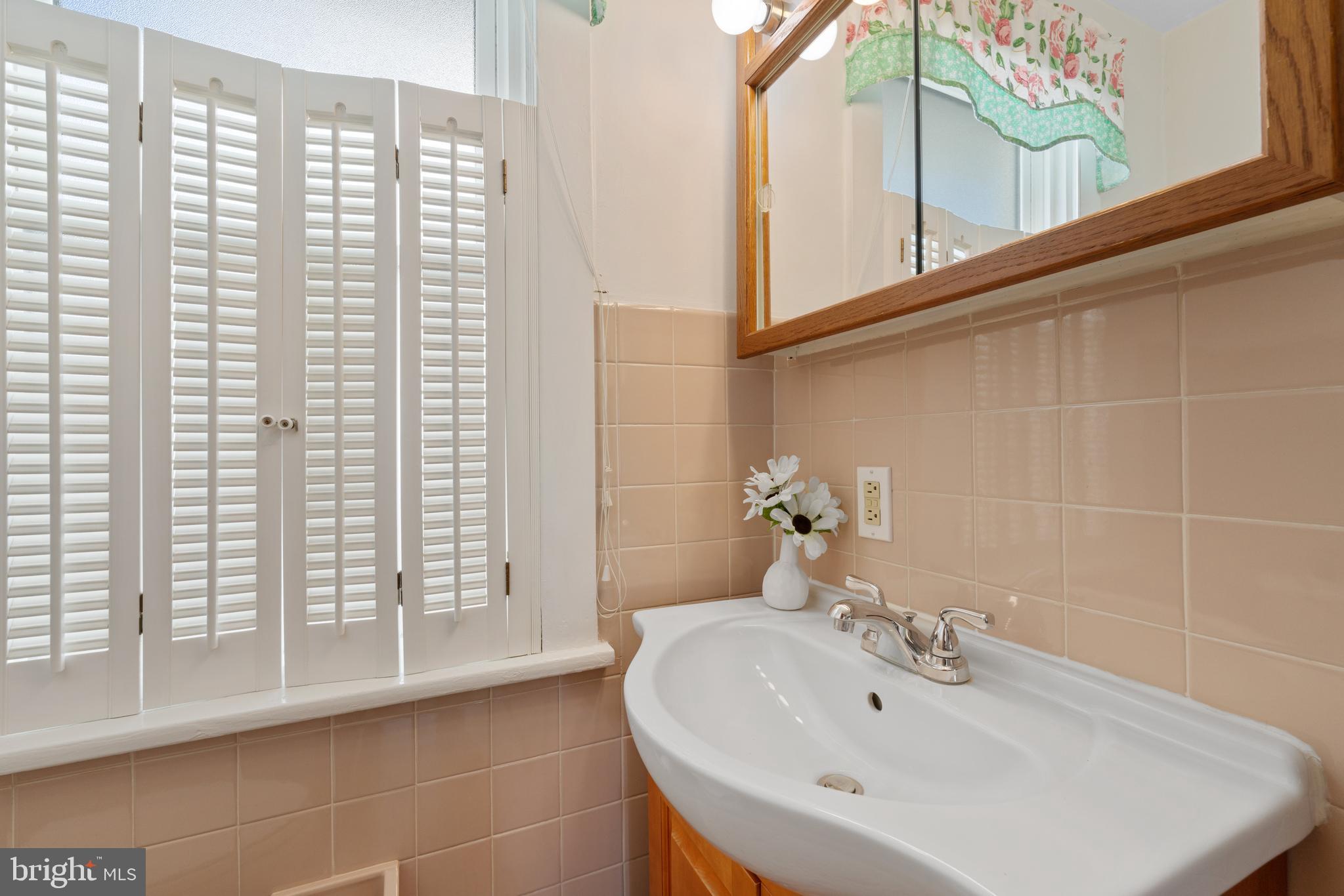 226 South Pine Avenue Maple Shade, NJ 08052 - Photo 19 of 39 a bathroom with a sink and a mirror
