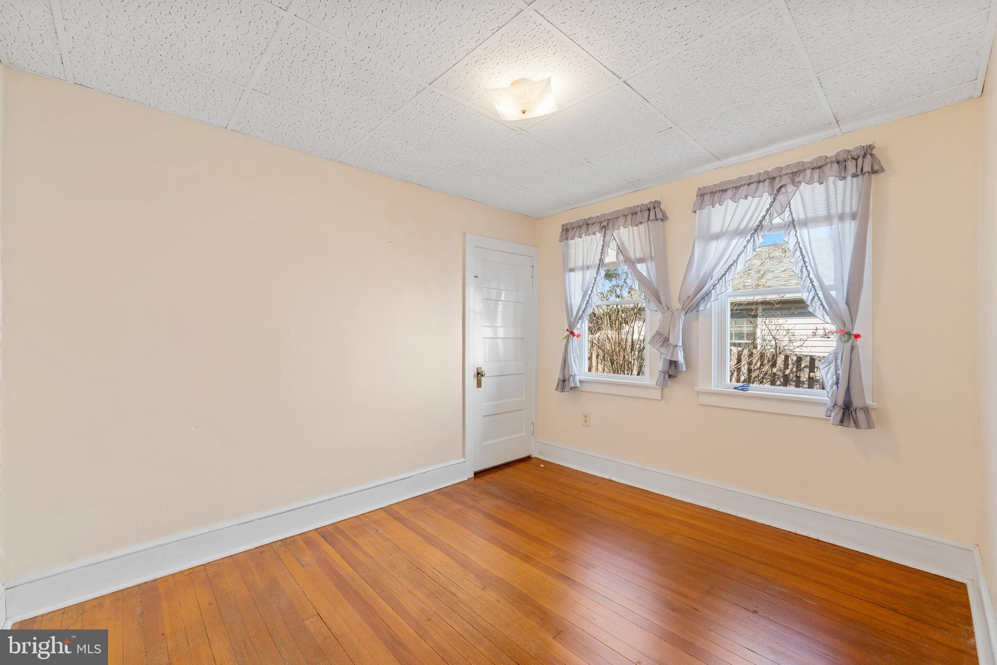 226 South Pine Avenue Maple Shade, NJ 08052 - Photo 23 of 39 an empty room with wooden floor and windows