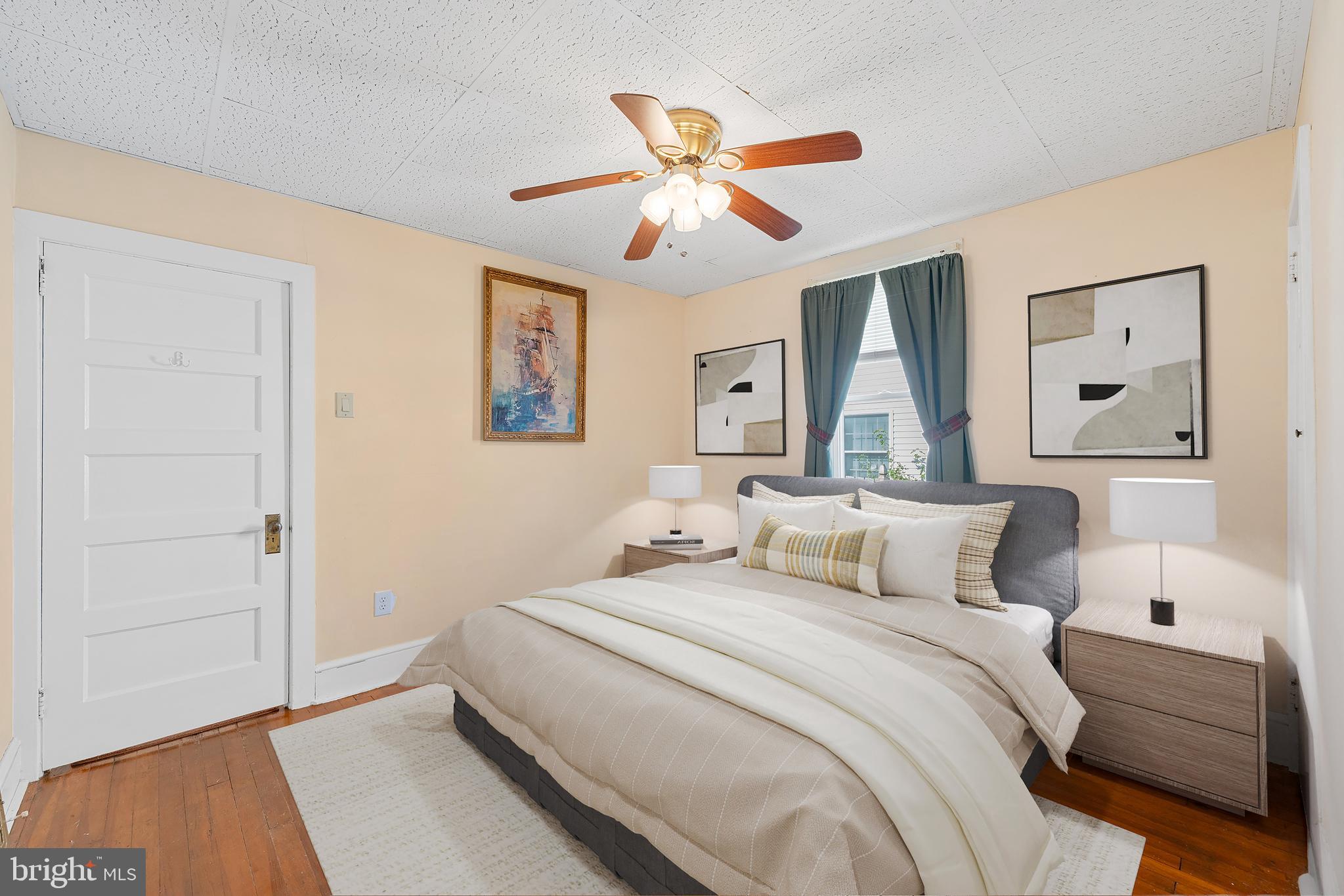 226 South Pine Avenue Maple Shade, NJ 08052 - Photo 24 of 39 a bedroom with a large bed and a chandelier