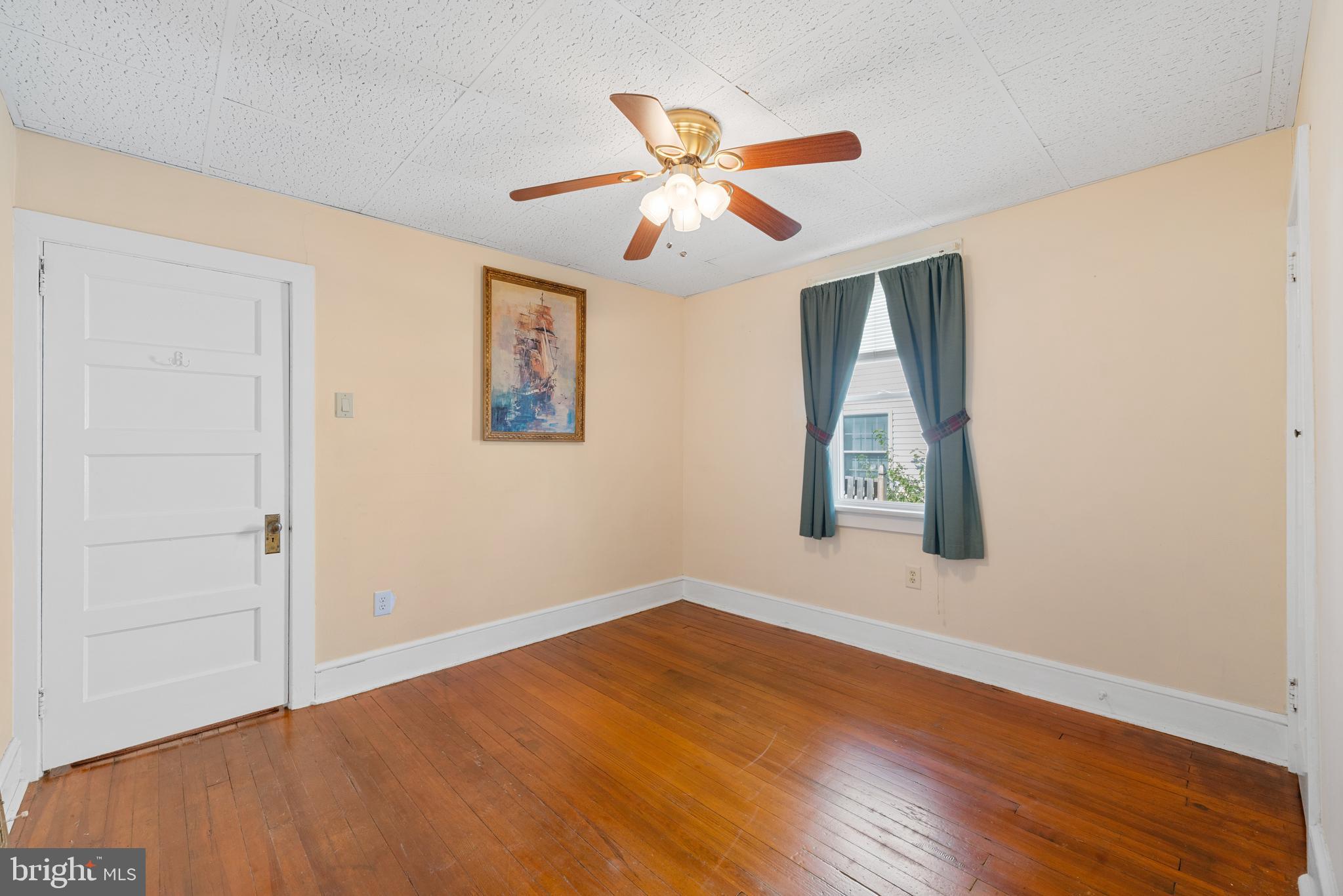 226 South Pine Avenue Maple Shade, NJ 08052 - Photo 25 of 39 a view of an empty room with wooden floor and a window