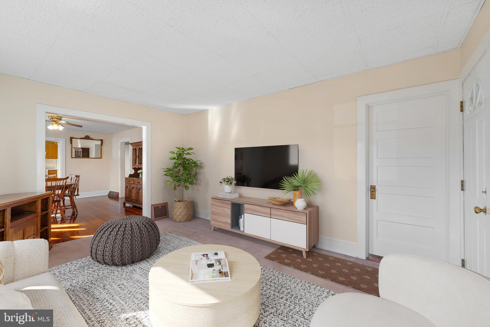 226 South Pine Avenue Maple Shade, NJ 08052 - Photo 7 of 39 a living room with furniture a rug and a flat screen tv