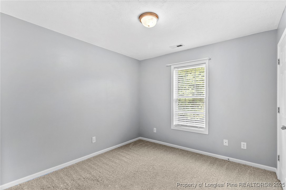 198 Cape Fear Road Raeford, NC 28376 - Photo 21 of 32 a view of an empty room with a window