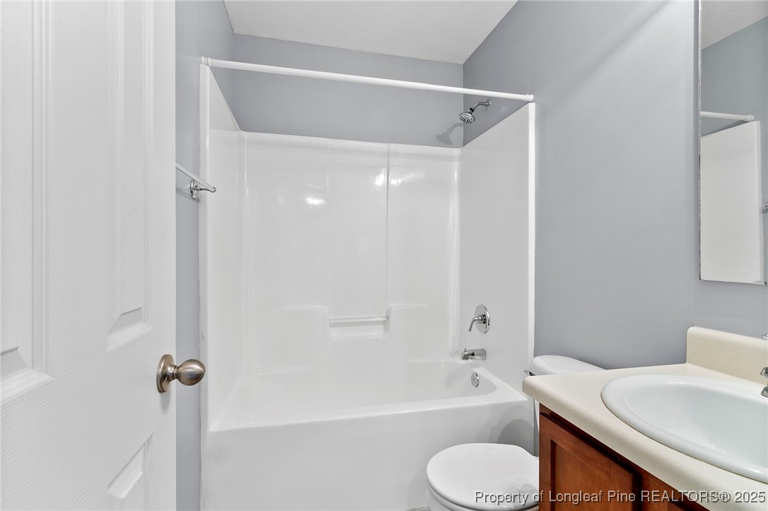198 Cape Fear Road Raeford, NC 28376 - Photo 23 of 32 a bathroom with a bathtub shower sink and a toilet
