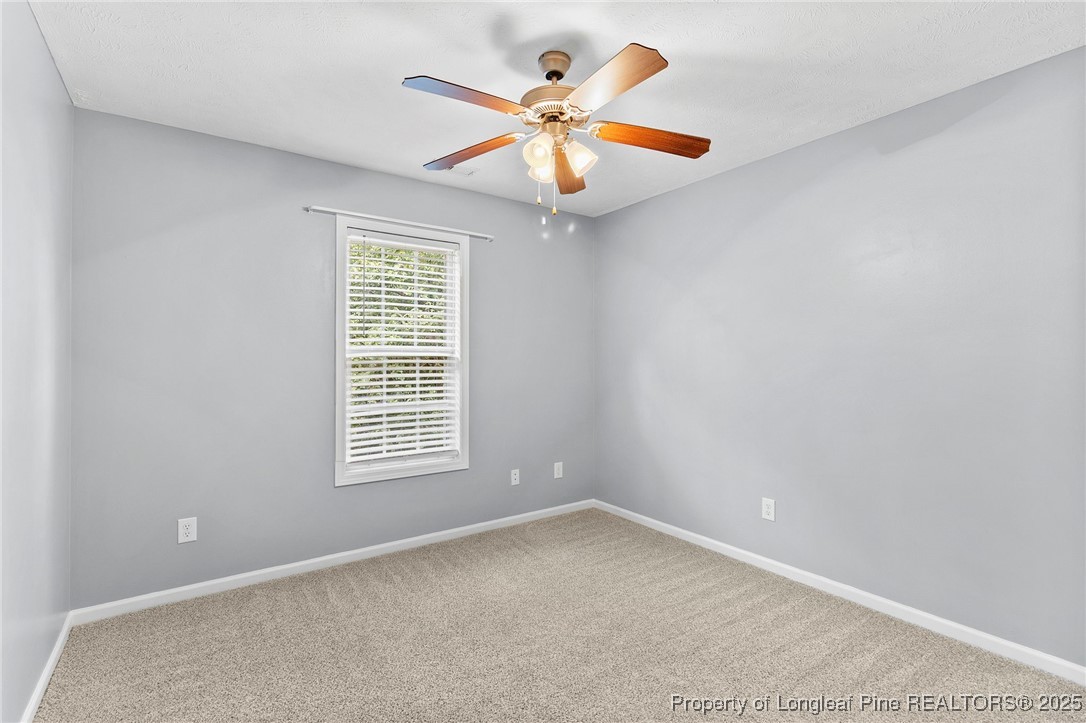 198 Cape Fear Road Raeford, NC 28376 - Photo 25 of 32 an empty room with windows and fan
