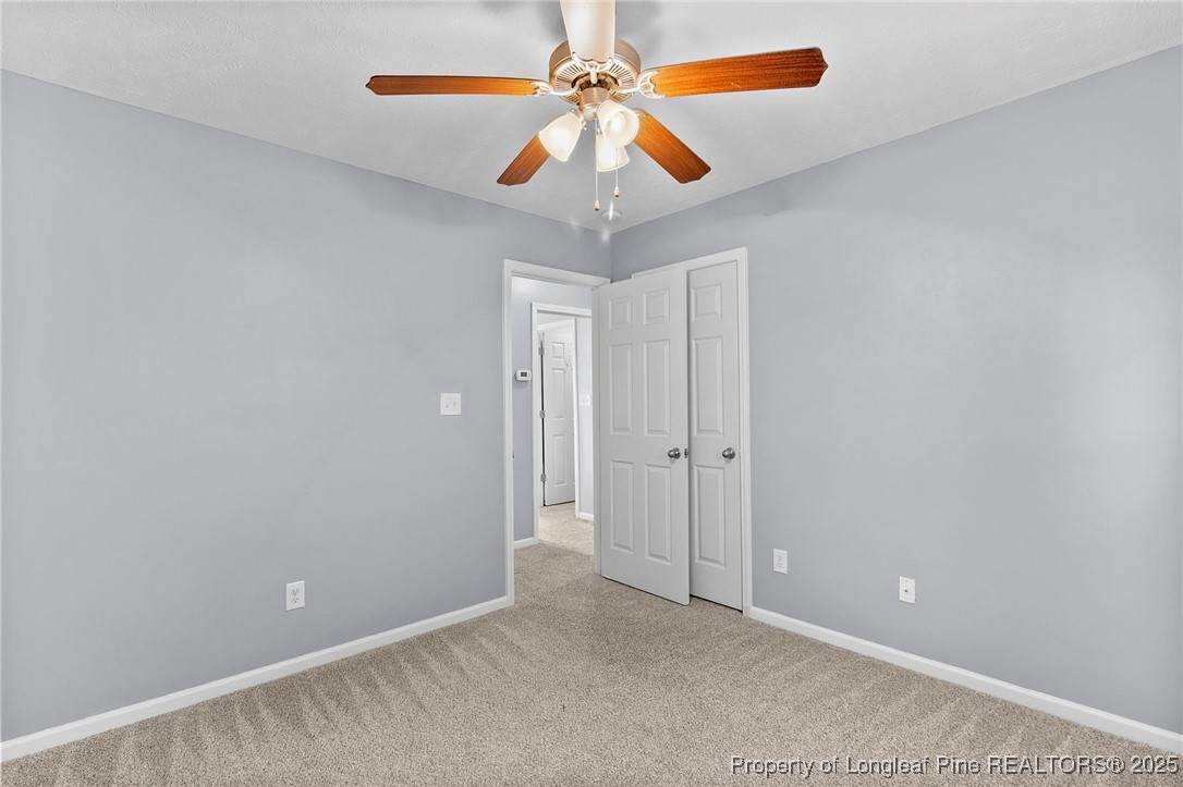 198 Cape Fear Road Raeford, NC 28376 - Photo 26 of 32 a view of an empty room with chandelier fan