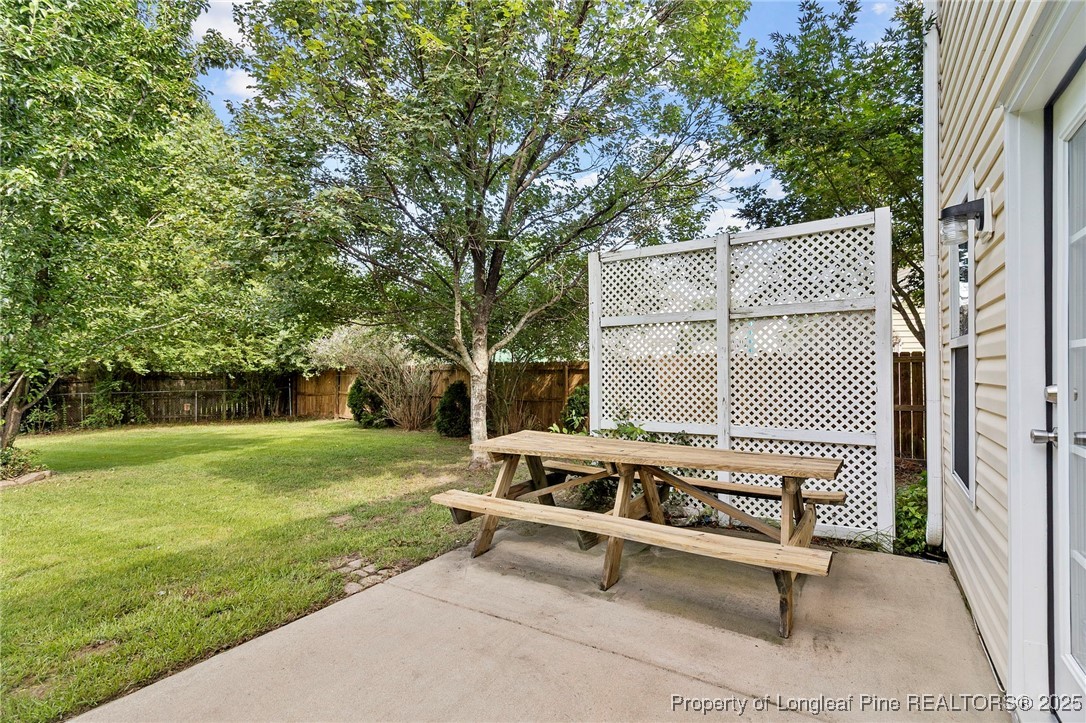 198 Cape Fear Road Raeford, NC 28376 - Photo 27 of 32 a view of a bench in the backyard of a house
