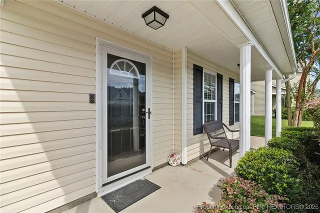 a backyard of a house with seating space