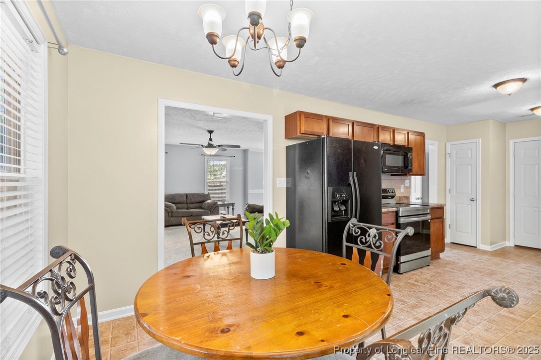 198 Cape Fear Road Raeford, NC 28376 - Photo 9 of 32 a dining room with wooden floor