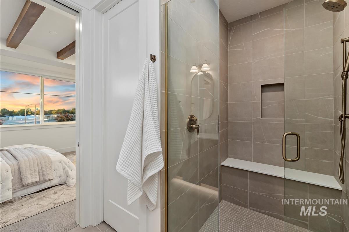 3243 West Moore Street Boise, ID 83702 - Photo 20 of 38 Ensuite bathroom featuring a shower stall and beamed ceiling
