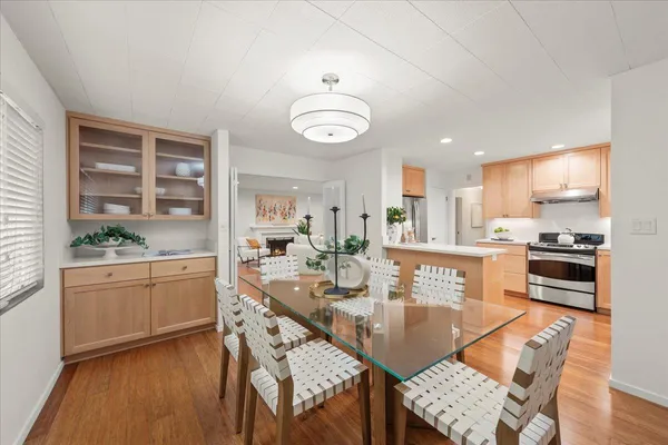 a kitchen with granite countertop lots of wooden furniture appliances cabinets and furniture
