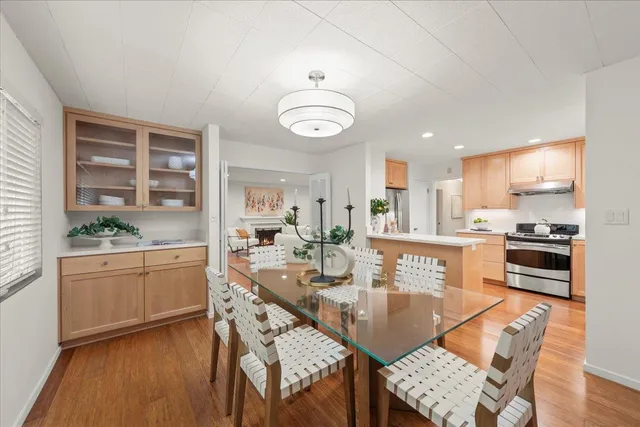 a kitchen with granite countertop lots of wooden furniture appliances cabinets and furniture