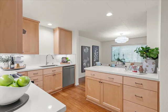 a spacious bathroom with a sink double vanity and mirror