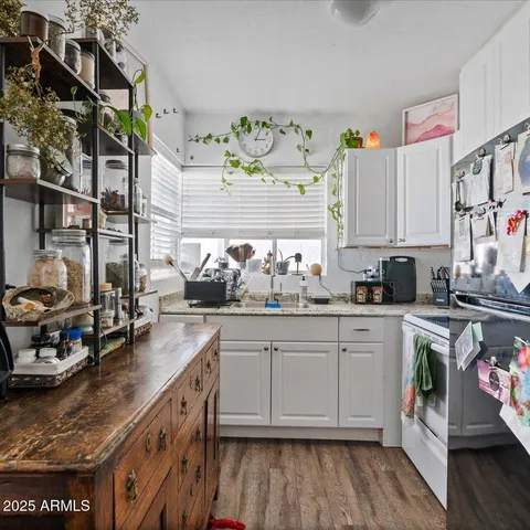 a living room with furniture flowerpot and window