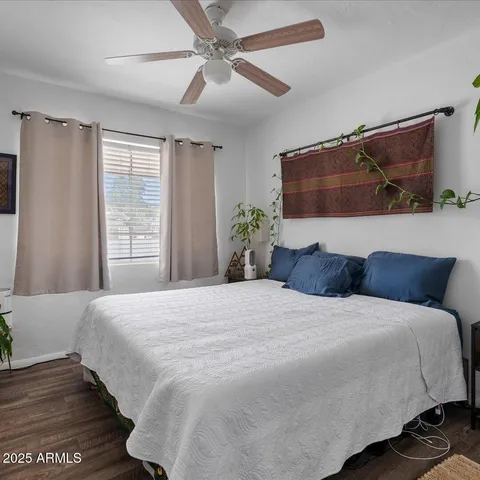 a kitchen with granite countertop lots of clutter and stainless steel appliances