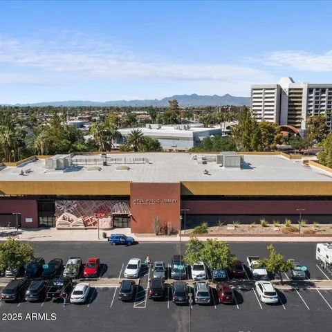 a view of a terrace with chairs and potted plants