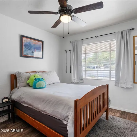 a white kitchen with cabinets a sink and a refrigerator