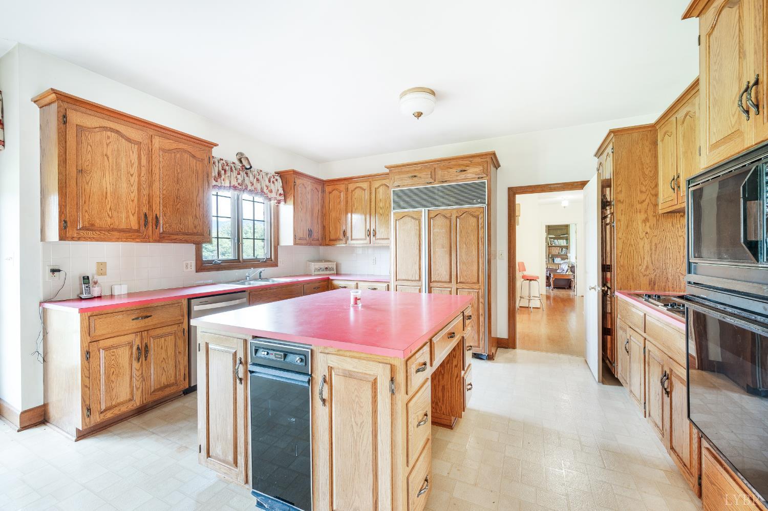 837 Gidsville Road Amherst, VA 24521 - Photo 29 of 82 a kitchen with a stove a sink and a refrigerator