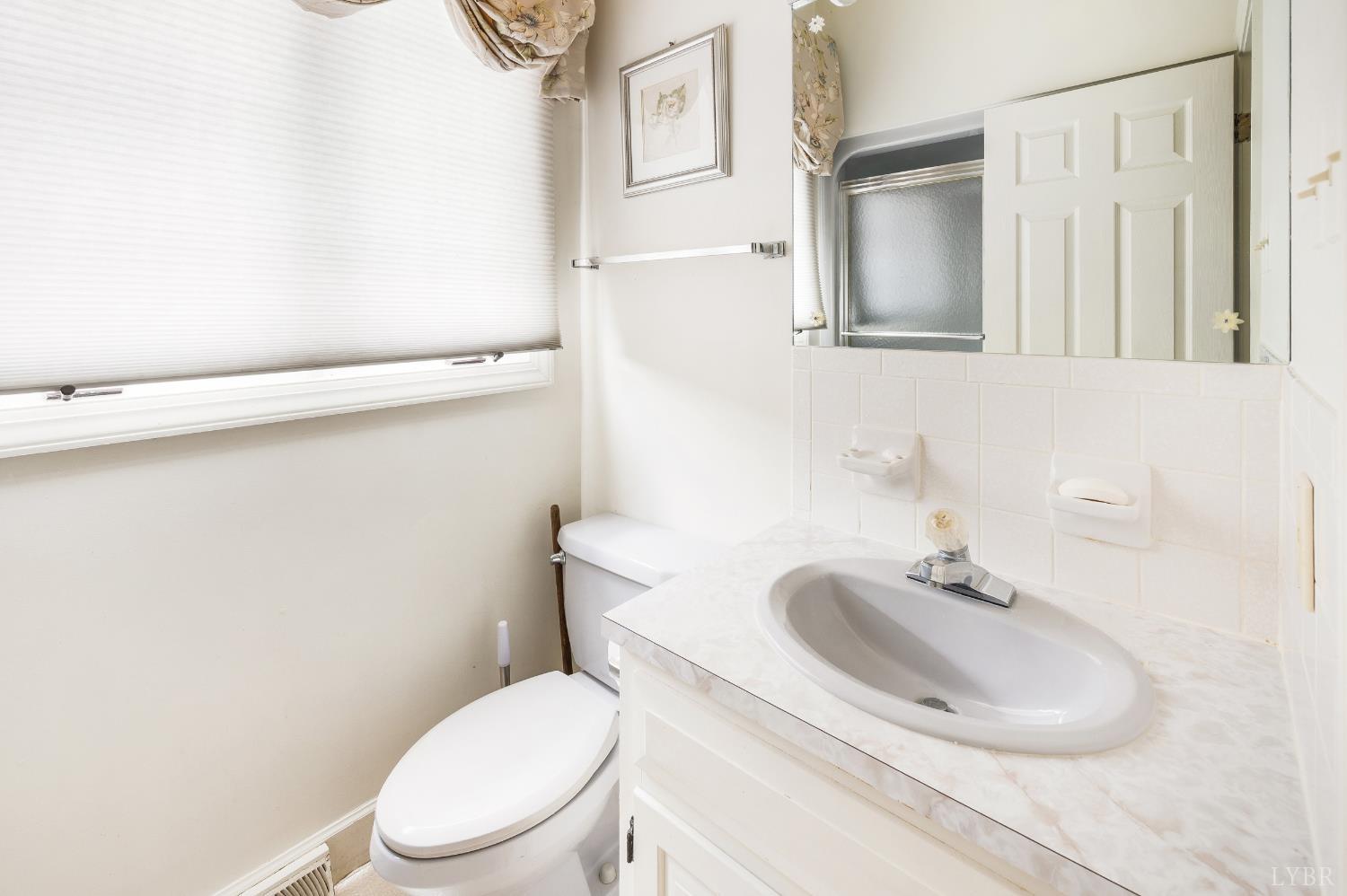 837 Gidsville Road Amherst, VA 24521 - Photo 60 of 82 a white toilet sitting next to a bathroom sink