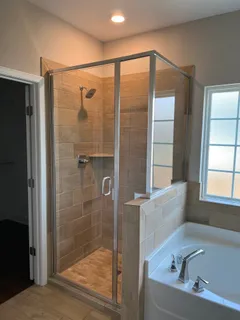 a bathroom with a bathtub and a shower