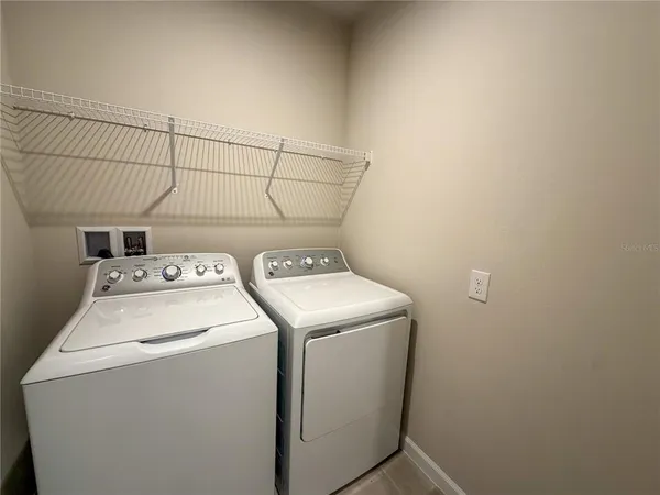 a utility room with dryer and washer