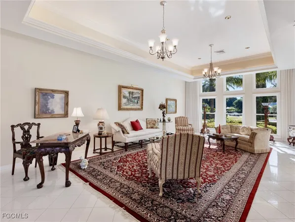 a view of a dining room with furniture large windows and wooden floor