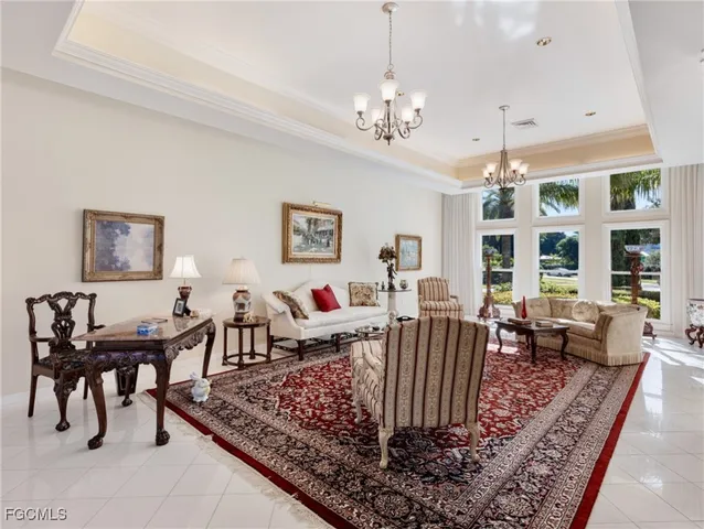 a view of a dining room with furniture large windows and wooden floor