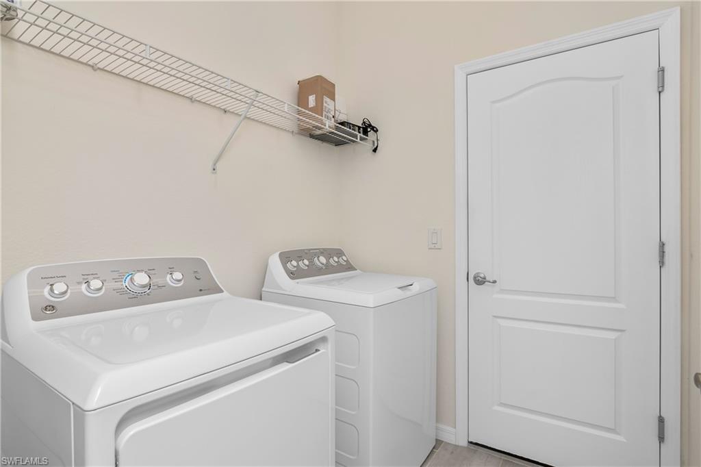 19952 Beverly Park Road Estero, FL 33928 - Photo 17 of 32 a utility room with dryer and washer