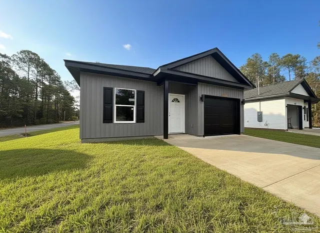 a house with yard in front of it