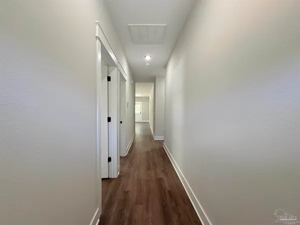 a kitchen with stainless steel appliances granite countertop a sink a stove a microwave a sink a refrigerator and cabinets