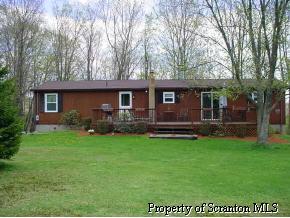 1240 McCarty Road Nicholson, PA 18446 - Photo 2 of 2 a view of a house with a yard porch and sitting area