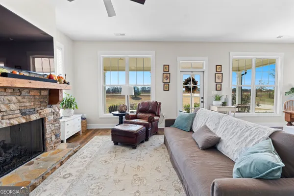 a view of living room kitchen and entryway