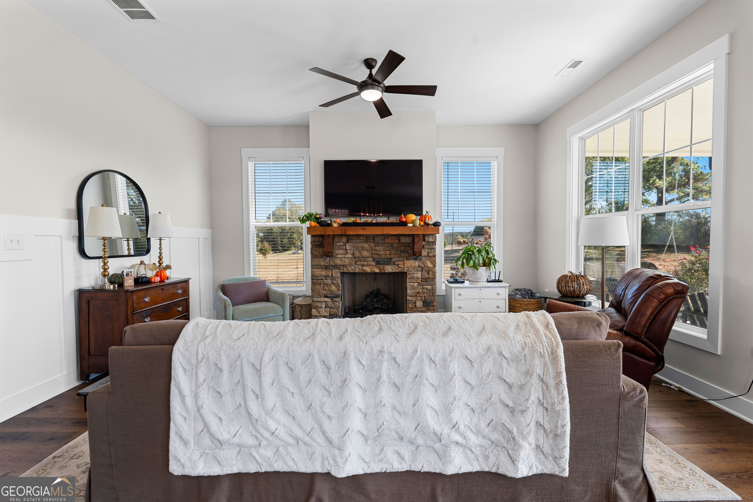 197 Dunn Road Molena, GA 30258 - Photo 13 of 76 a living room with furniture a fireplace and a flat screen tv