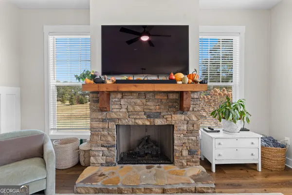 a dining room with furniture and wooden floor