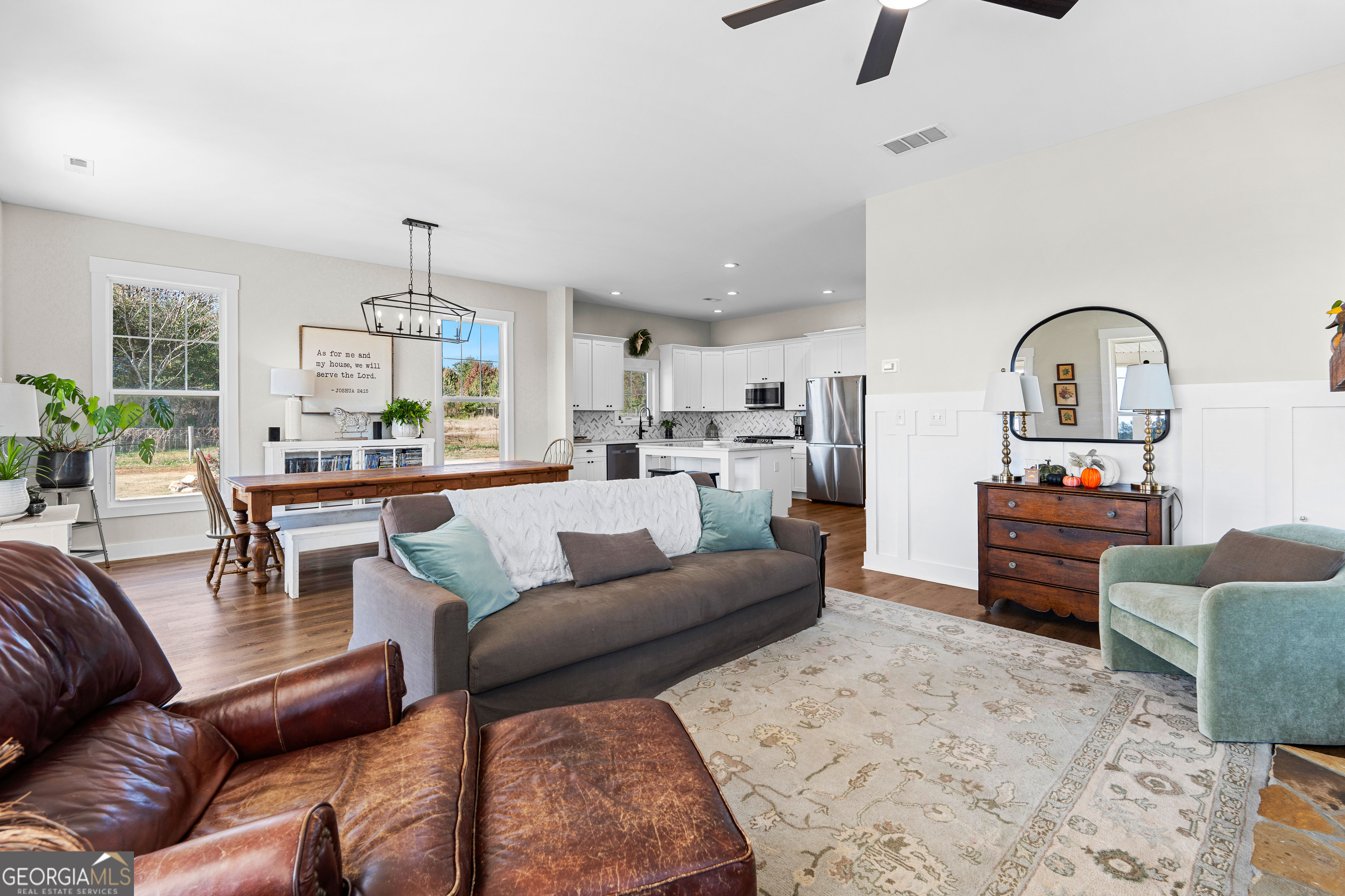 197 Dunn Road Molena, GA 30258 - Photo 15 of 76 a living room with furniture kitchen view and a wooden floor