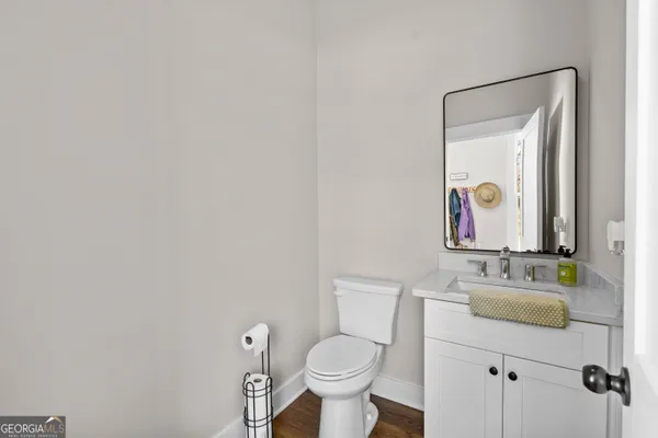 a bedroom with a bed and a mirror