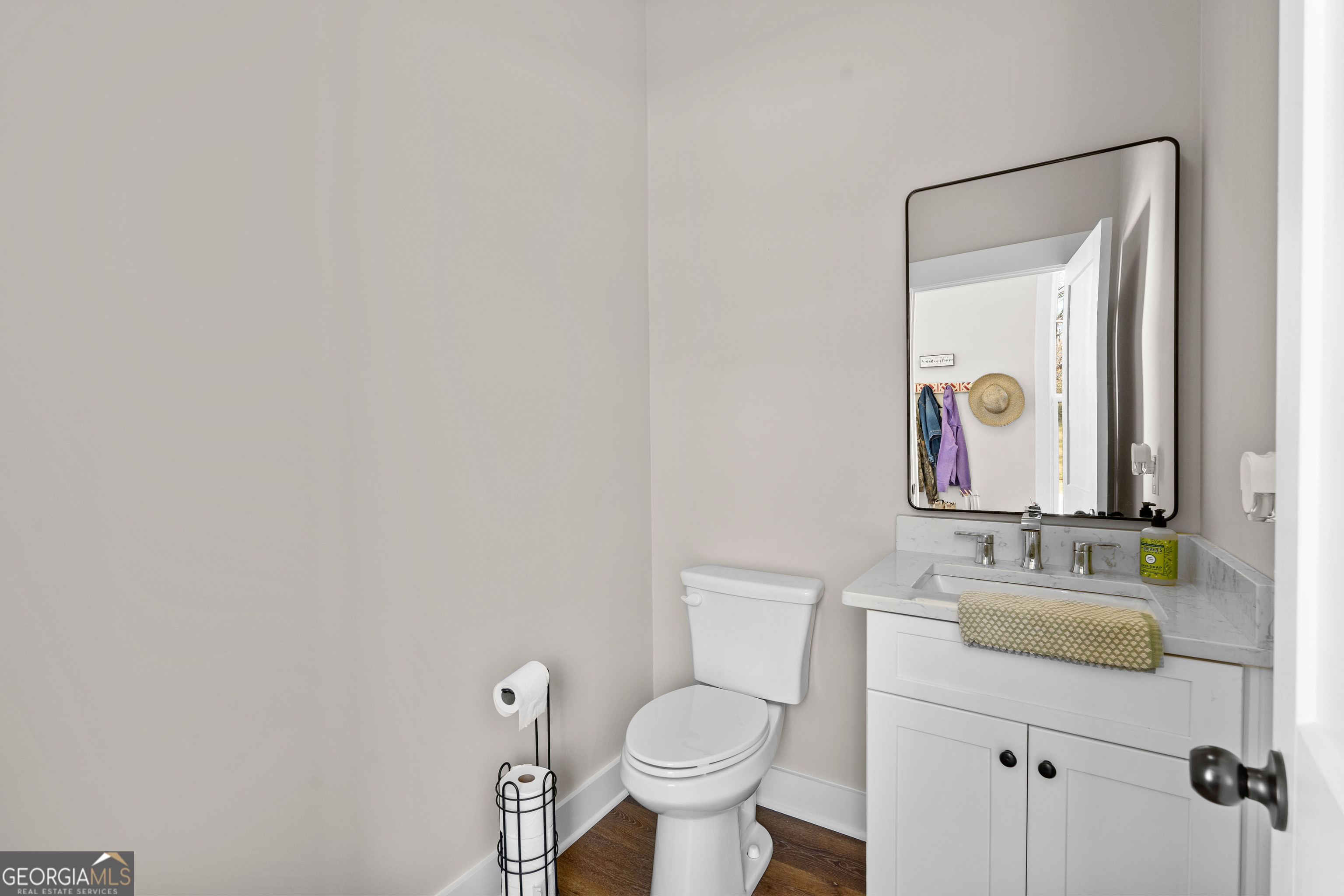 197 Dunn Road Molena, GA 30258 - Photo 25 of 76 a bathroom with a toilet sink and mirror