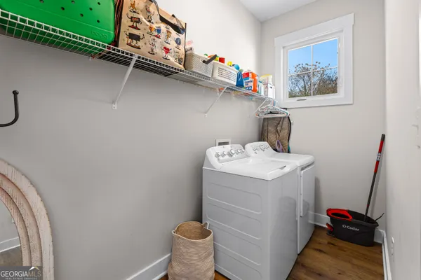 a bathroom with double sink and a mirror