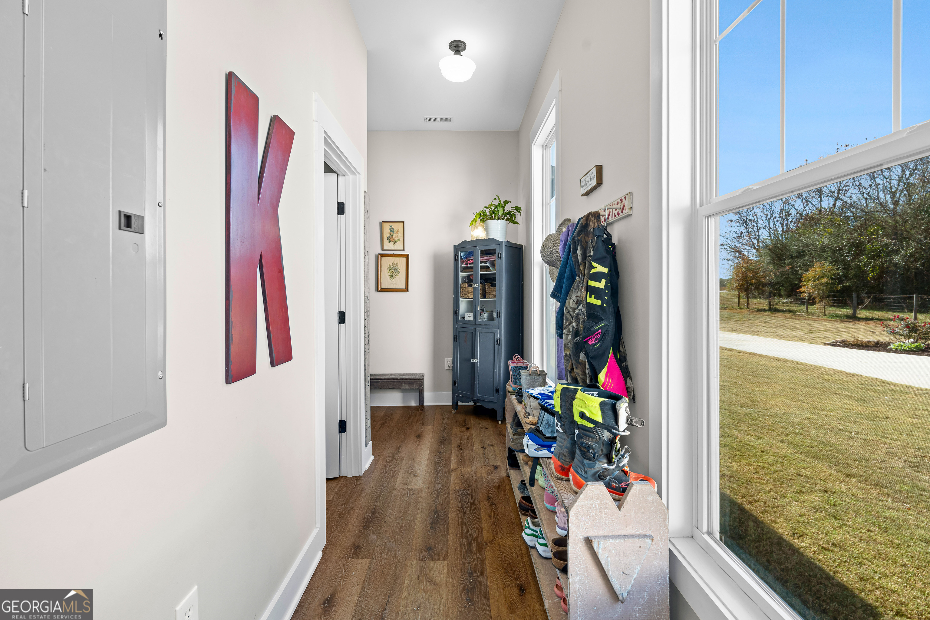 197 Dunn Road Molena, GA 30258 - Photo 28 of 76 a view of a hallway with furniture and floor to ceiling window